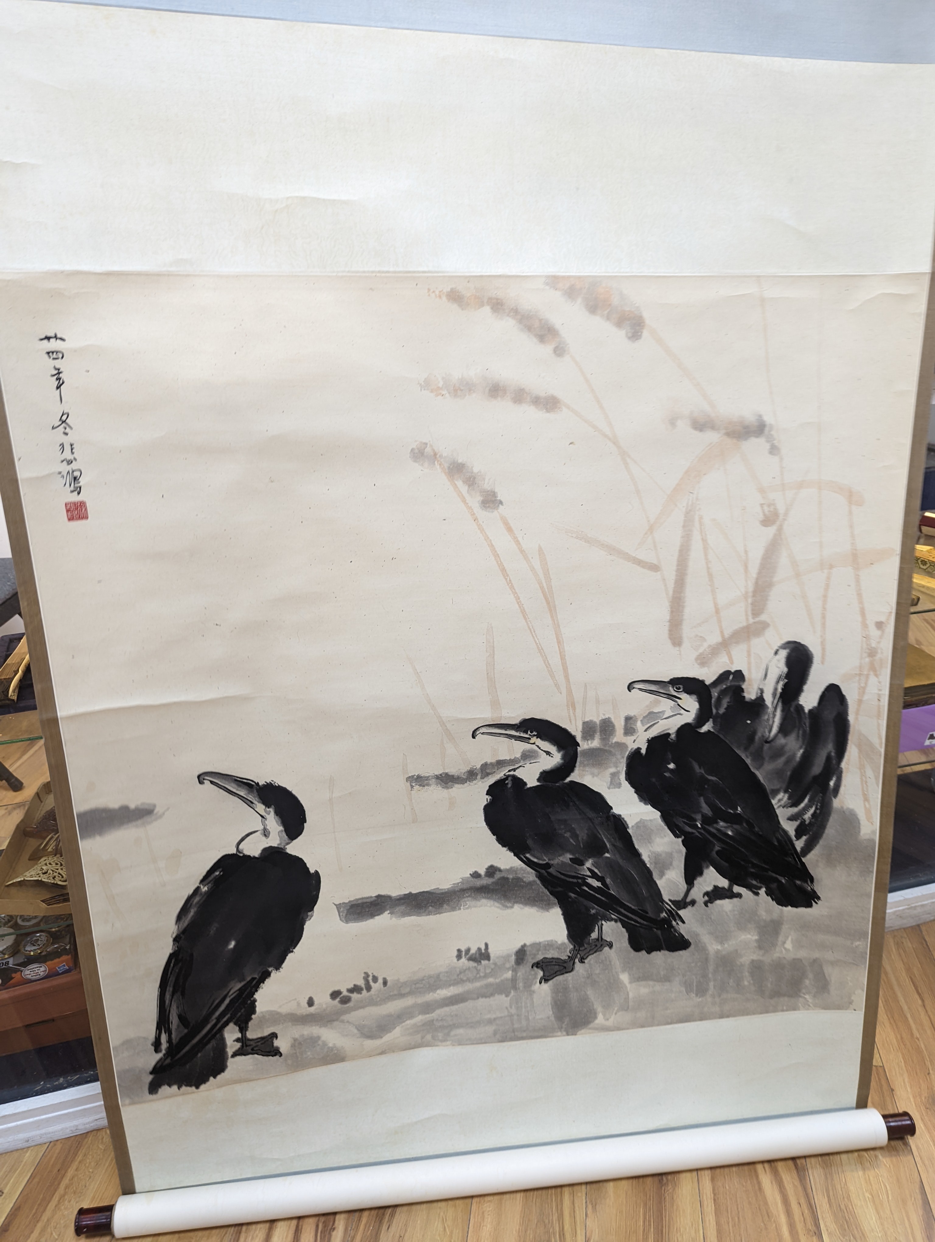 Two mid 20th century Japanese watercolour on paper scroll paintings, Boatman in a landscape, 79.5 x 113cm, and Cormorants on a bank, 103 x 106cm